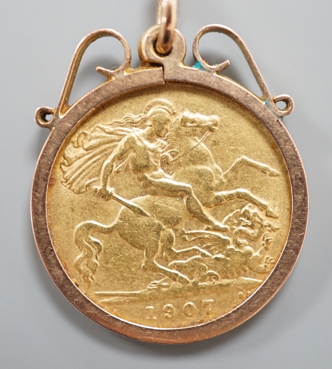 An Edward VII gold half sovereign, now in 9ct pendant mount.
